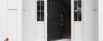 Partially open front door of a home.