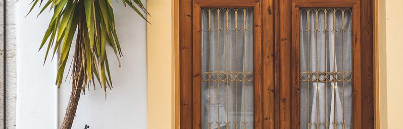 Stylish front door with potted plants.